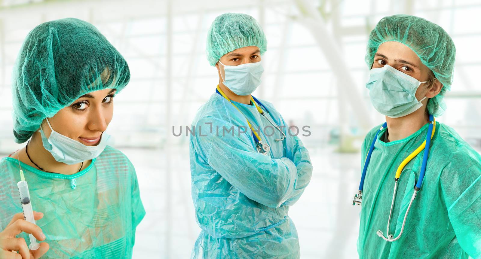 three young doctors, isolated on white background