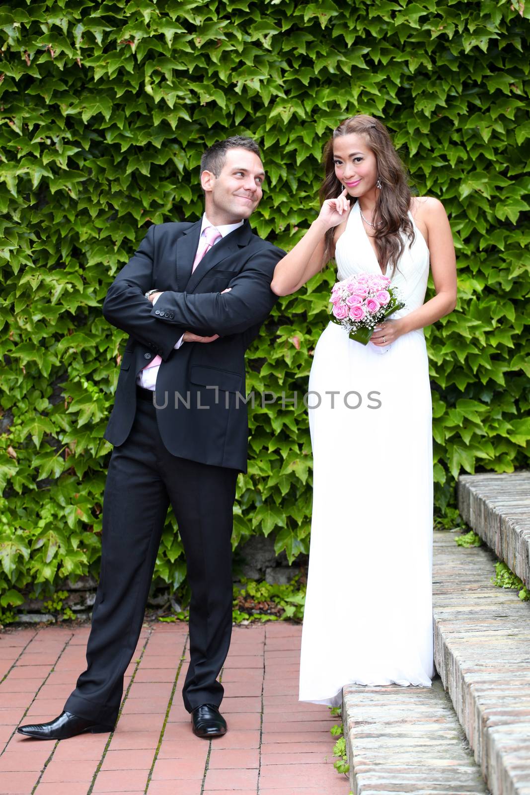 Portrait of a young bride and groom