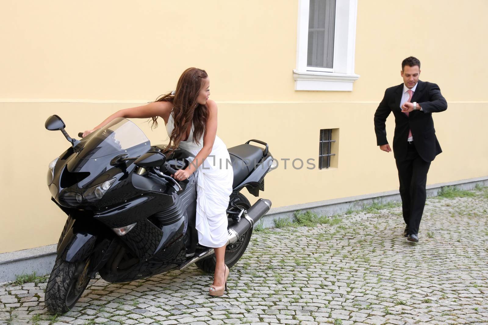 Wedding on the nature, young wedding couple with motorbike