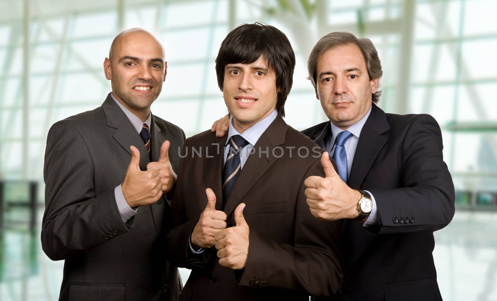 three young business men isolated at the office