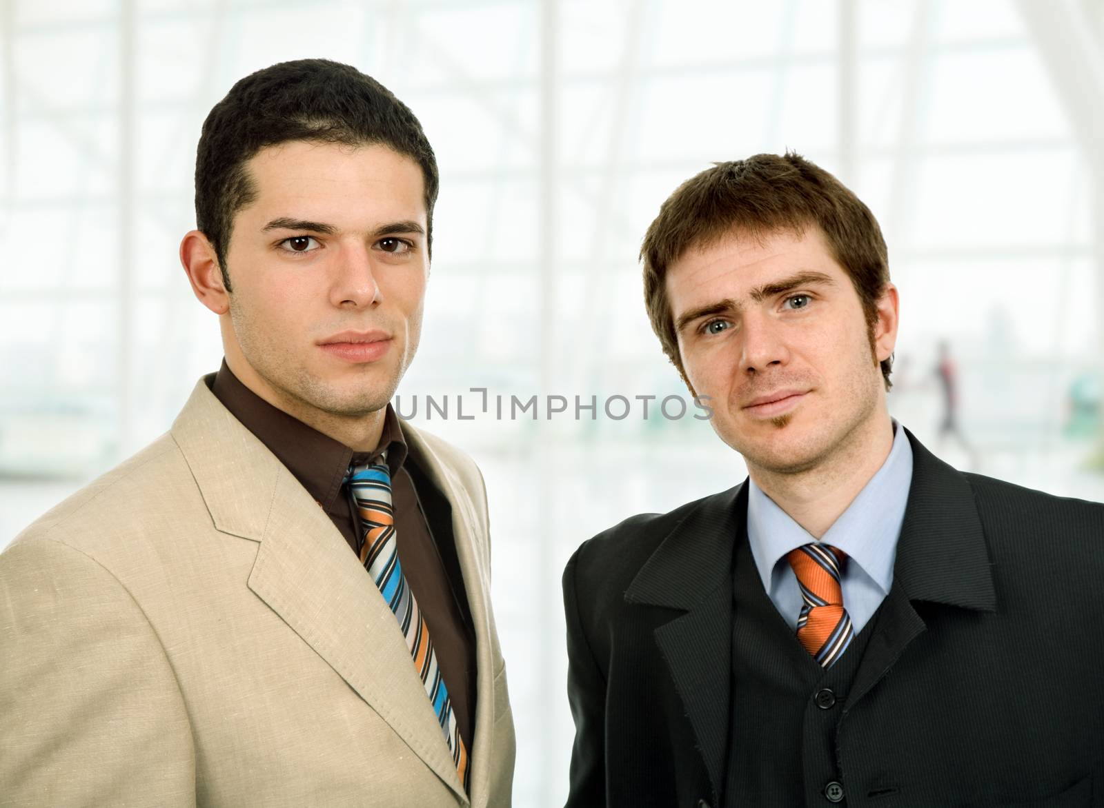 two young business men portrait at the office