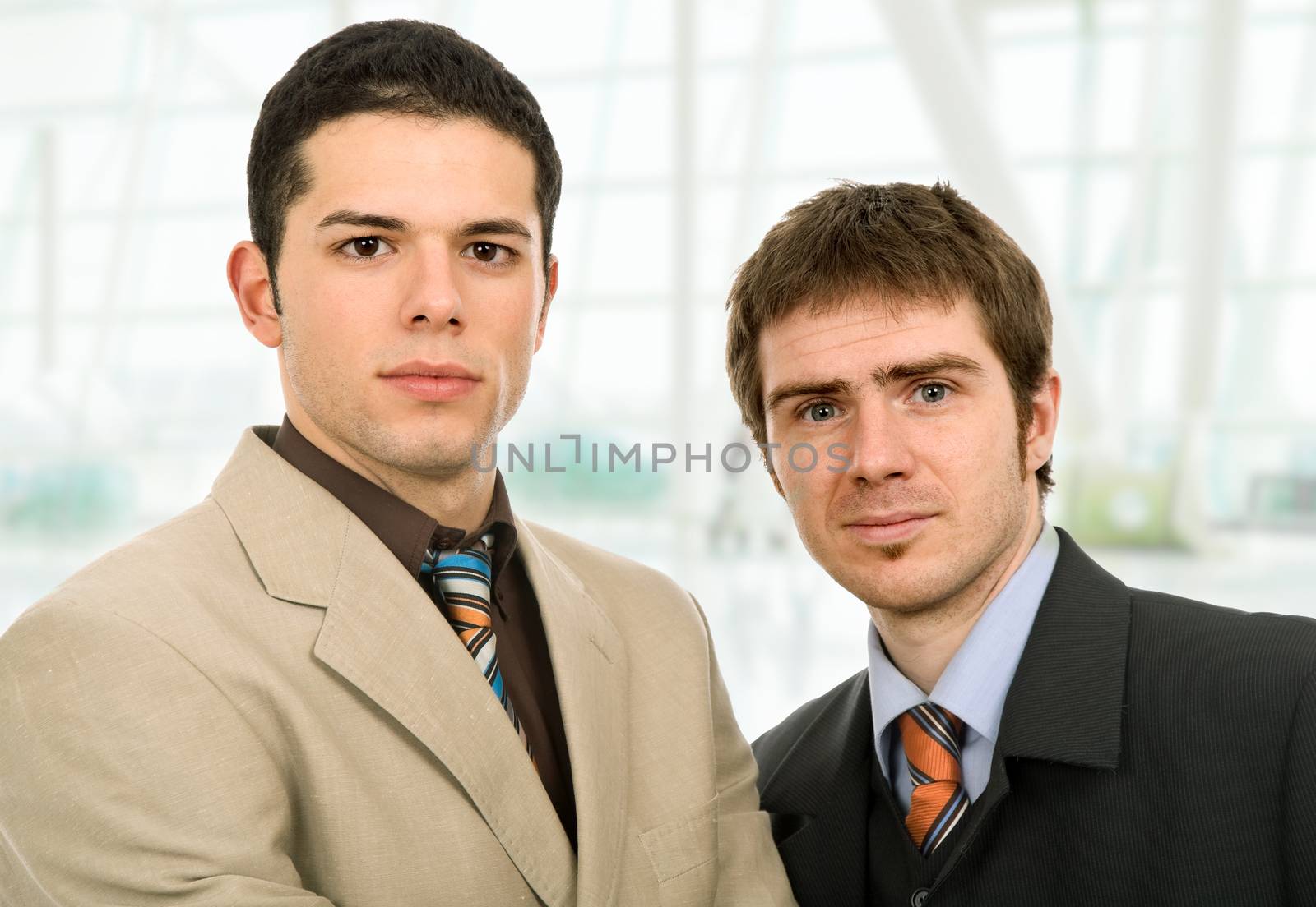 two young business men portrait at the office