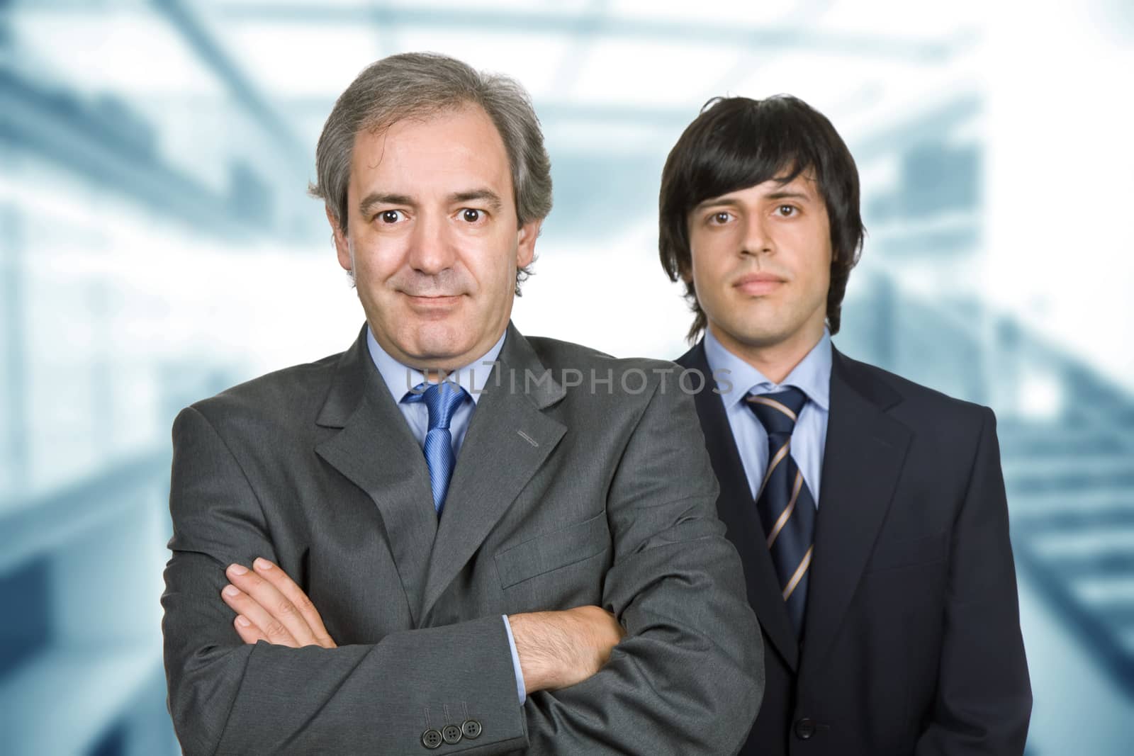 two young business men at the office, focus on the left man