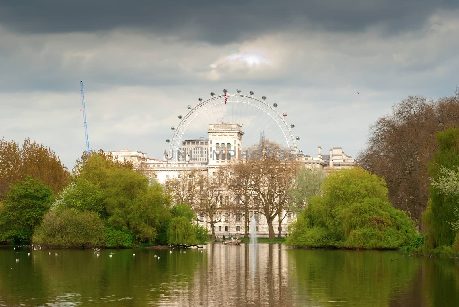 St. James Park lake with Horse Guards and London Eye in the background. by mitakag