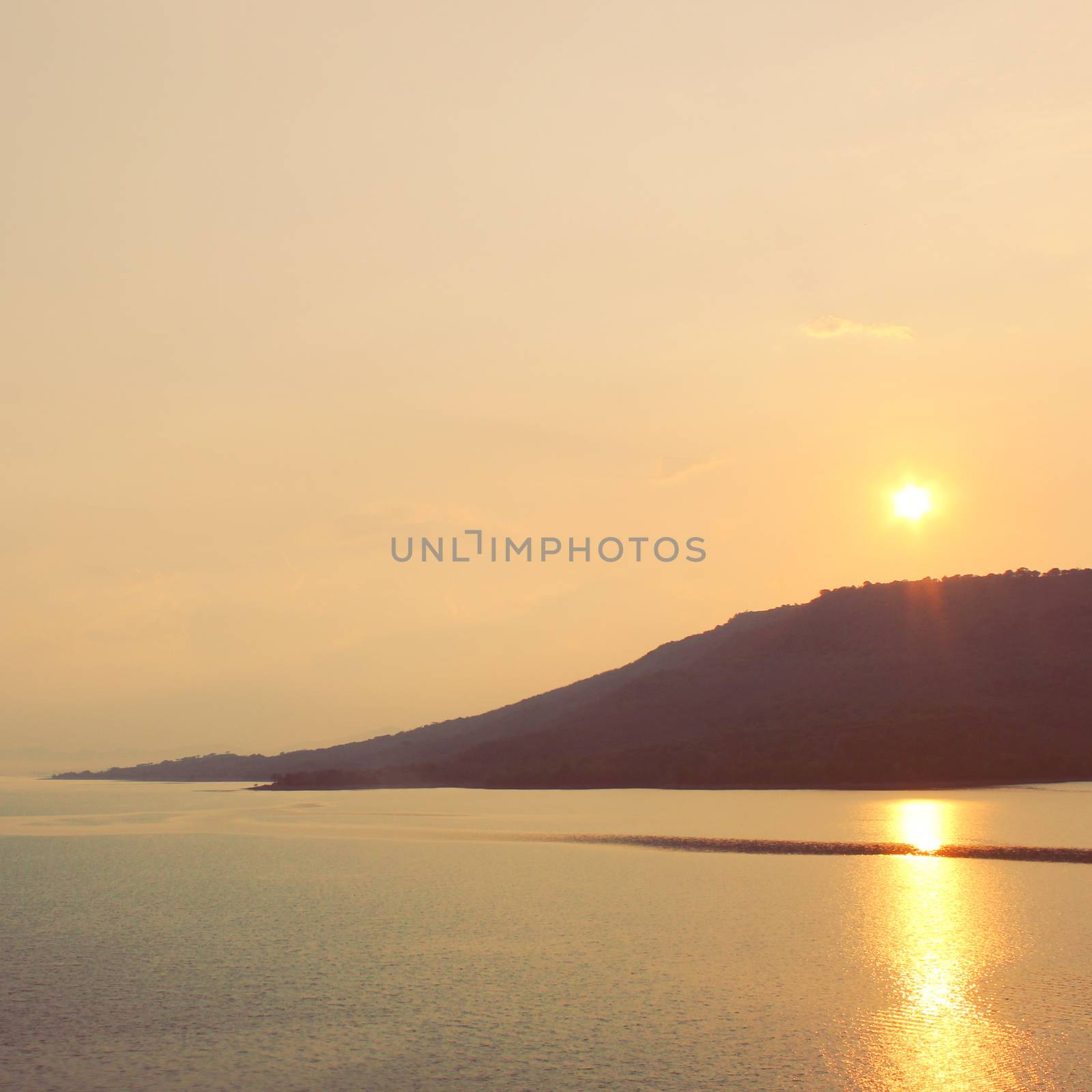 Sunrise or sunset over the sea and mountain with retro filter ef by nuchylee