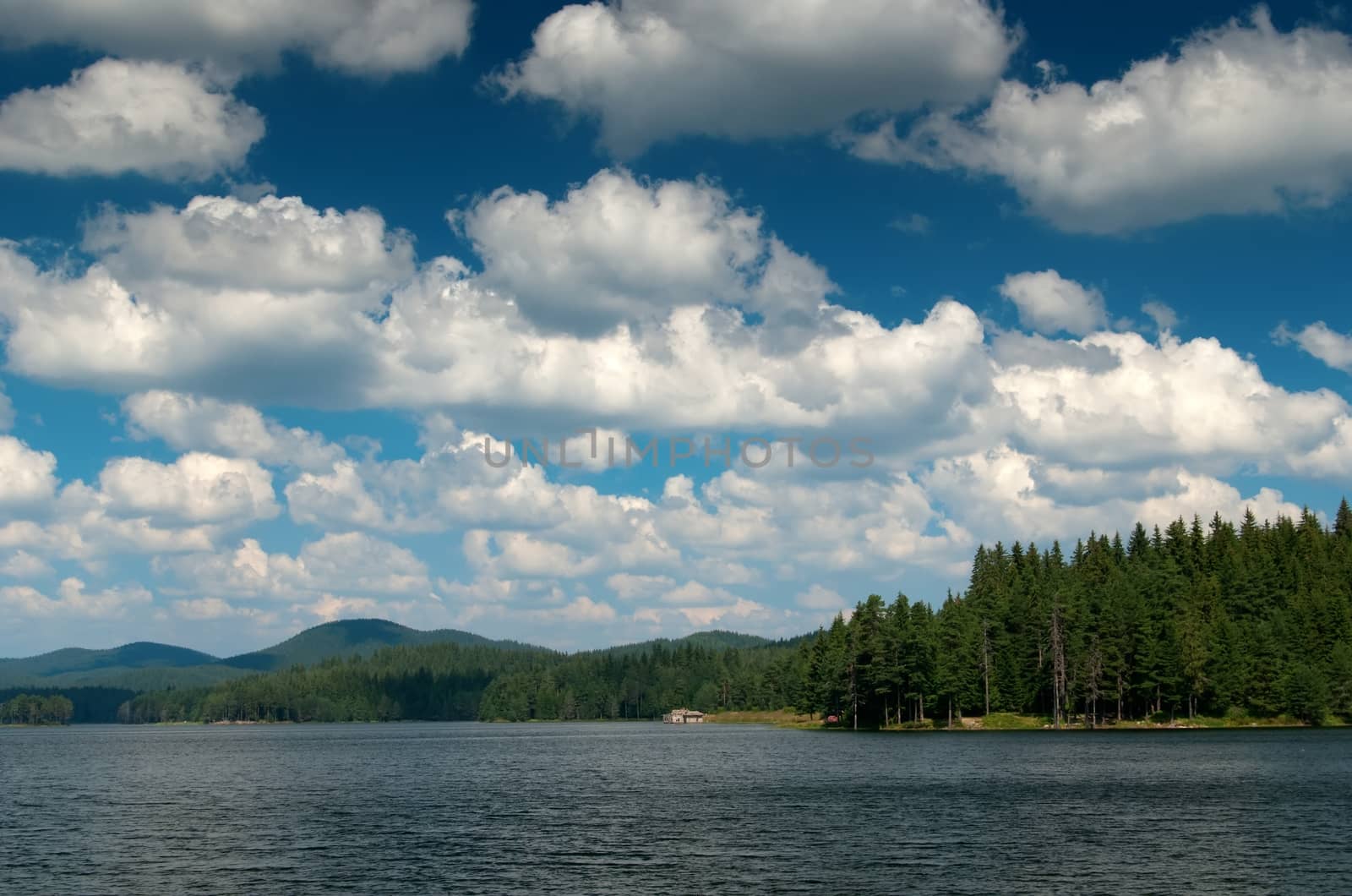 Mountain lake with cloudy sky by mitakag