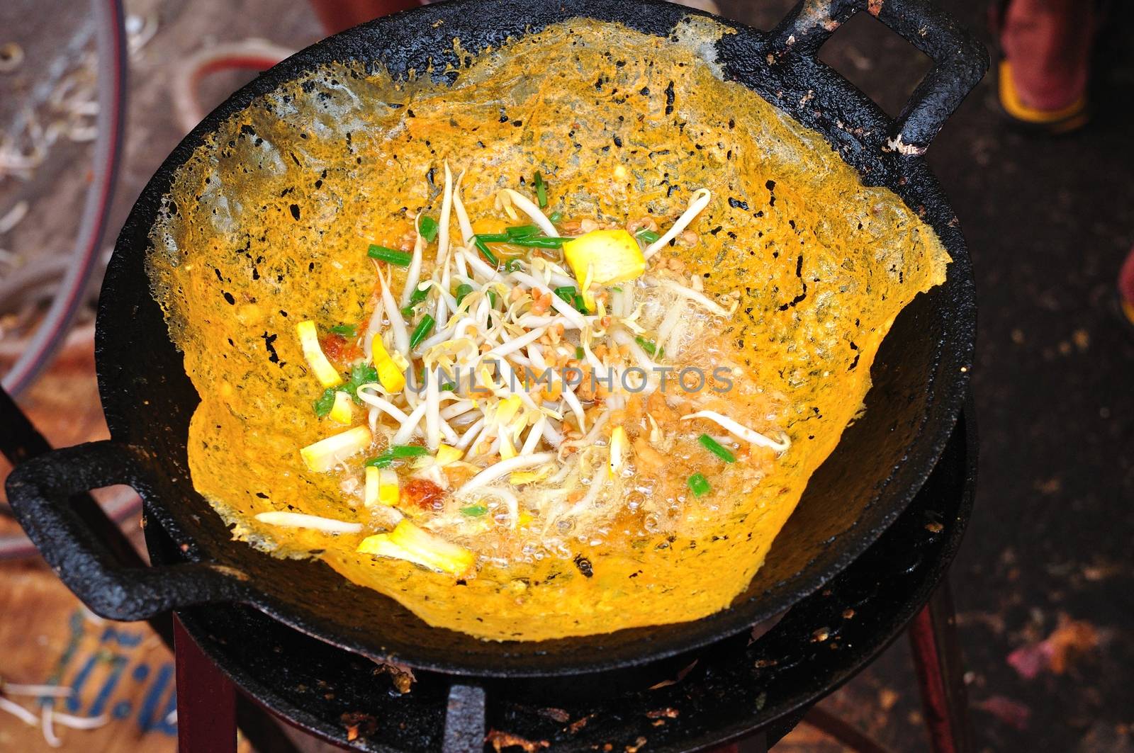 Vietnamese stuffed crispy omelette ,khanom beuangyuan fried in the pan