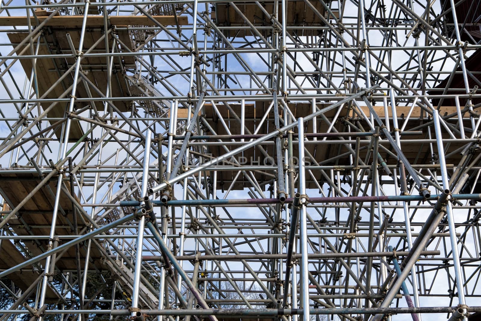 Metal scaffold on construction site by mitakag