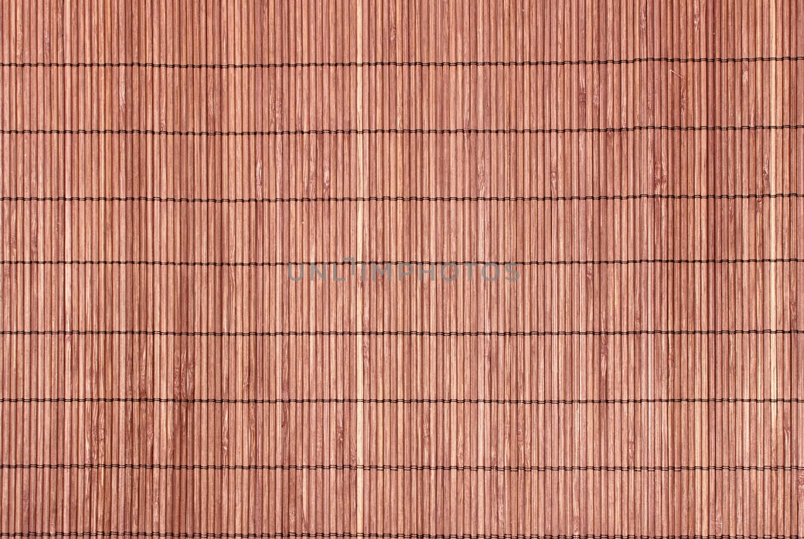 Bamboo brown straw mat as abstract texture background composition, top view above