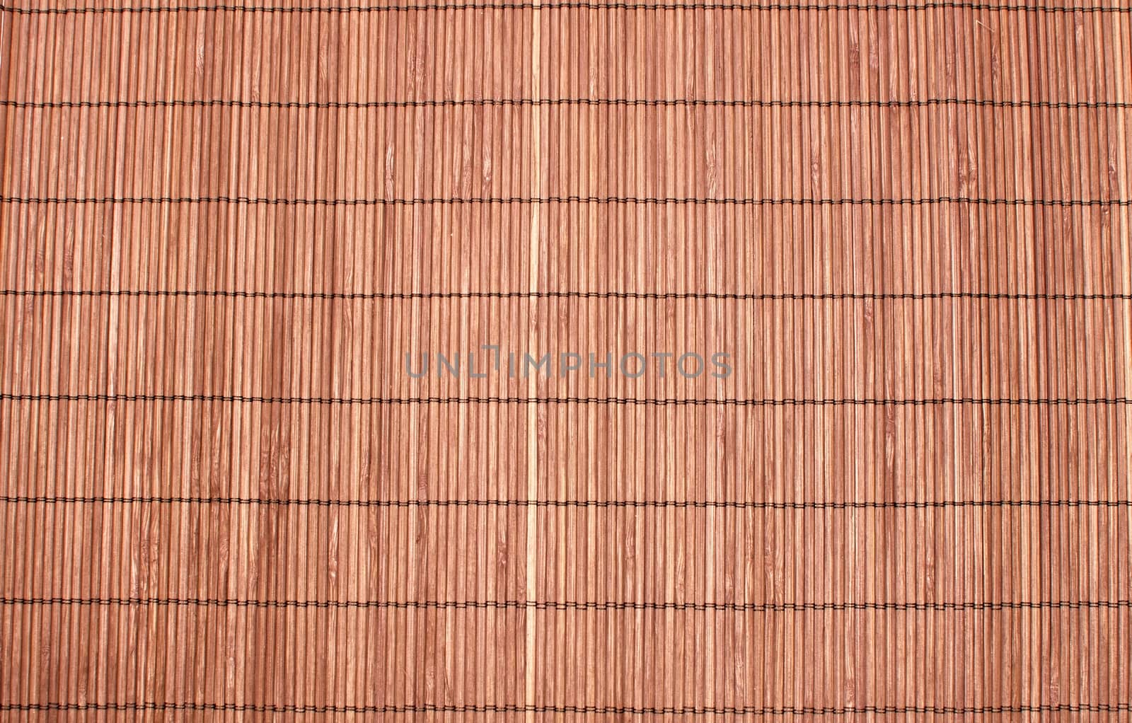 Bamboo brown straw mat as abstract texture background composition, top view above