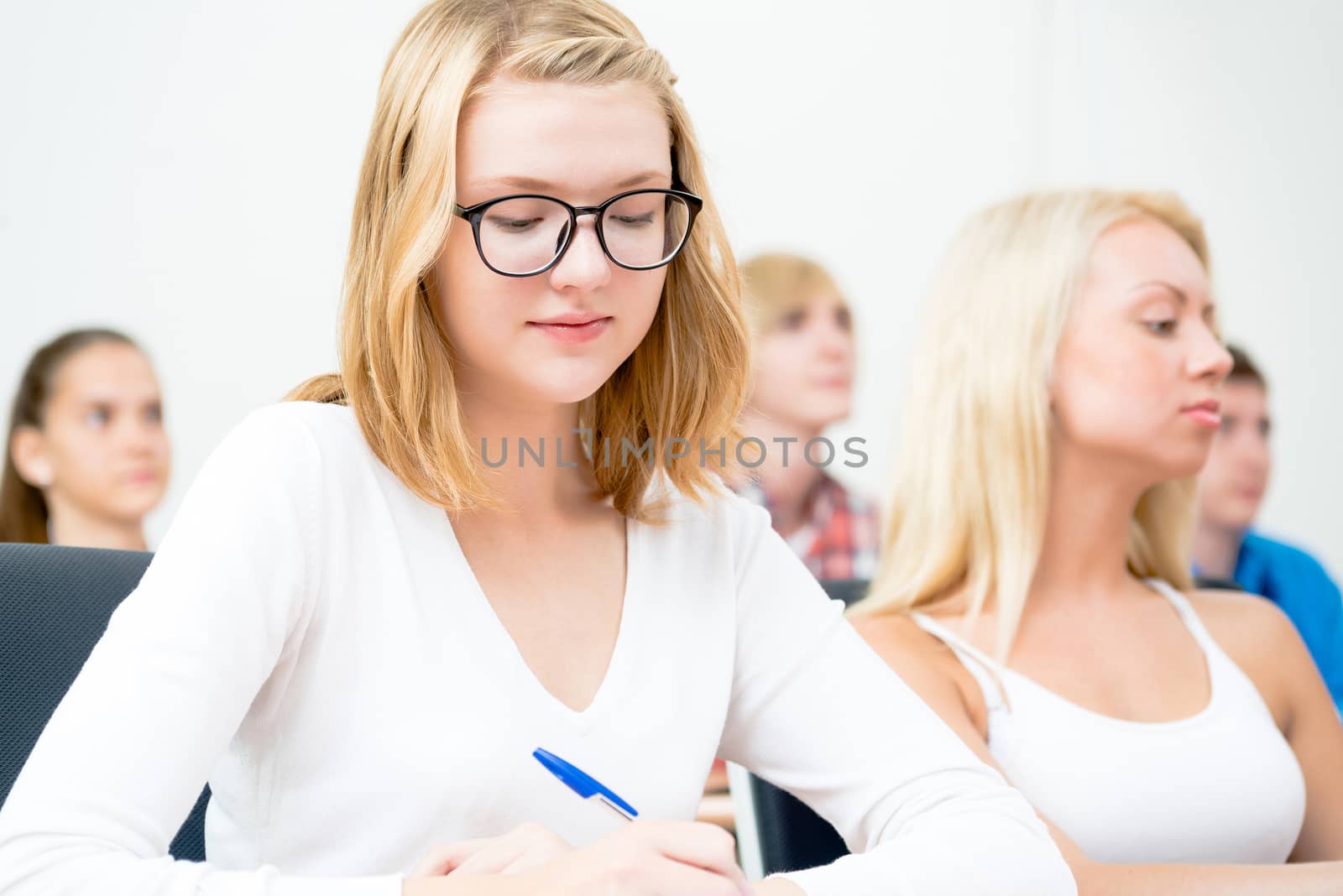 image of a young female students in the classroom, teaching at the University of