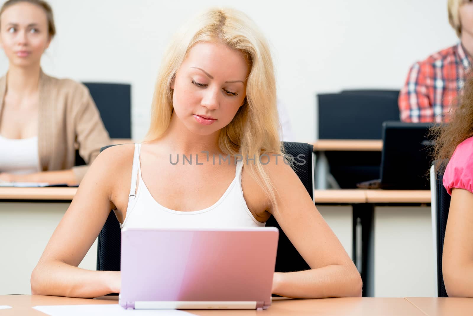 portrait of young female student in the classroom, teaching at the University of