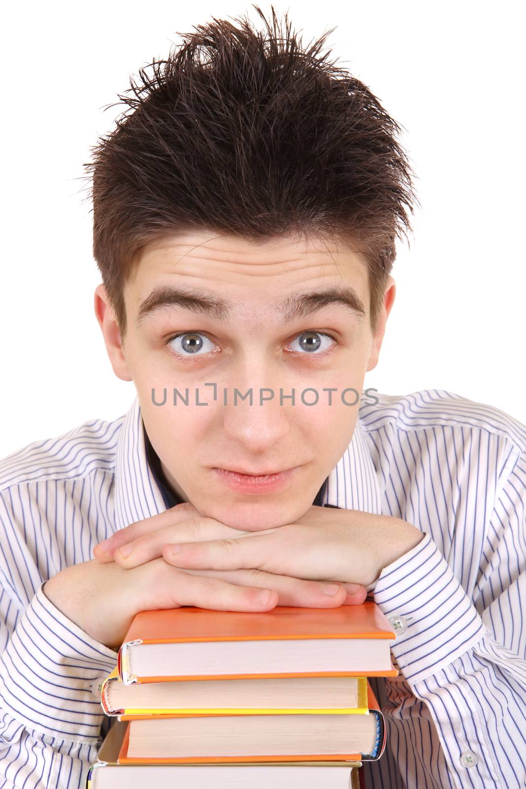 Handsome Teenager behind the Books Isolated on the White Background