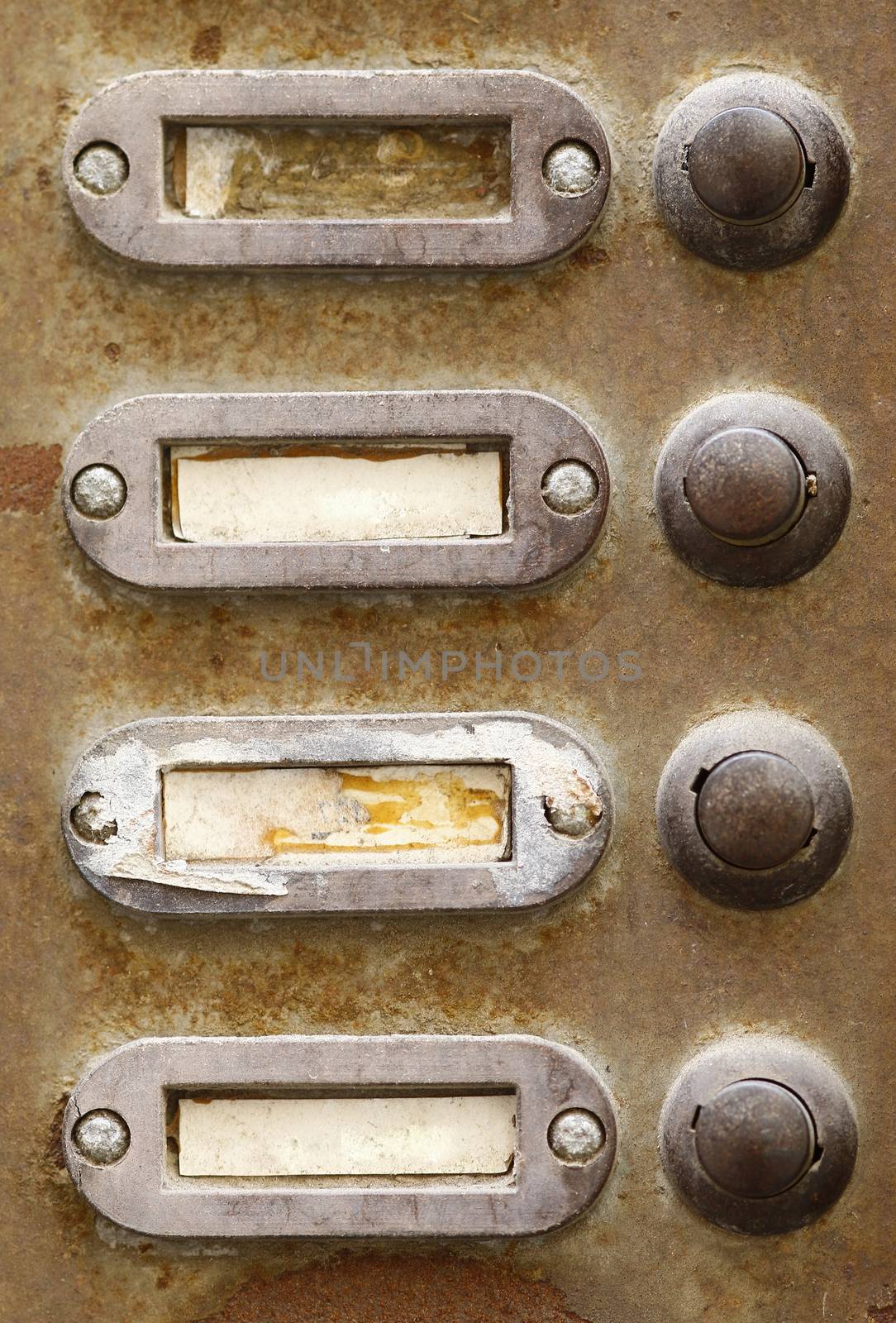 Detail of the old and damaged doorbells - buttons