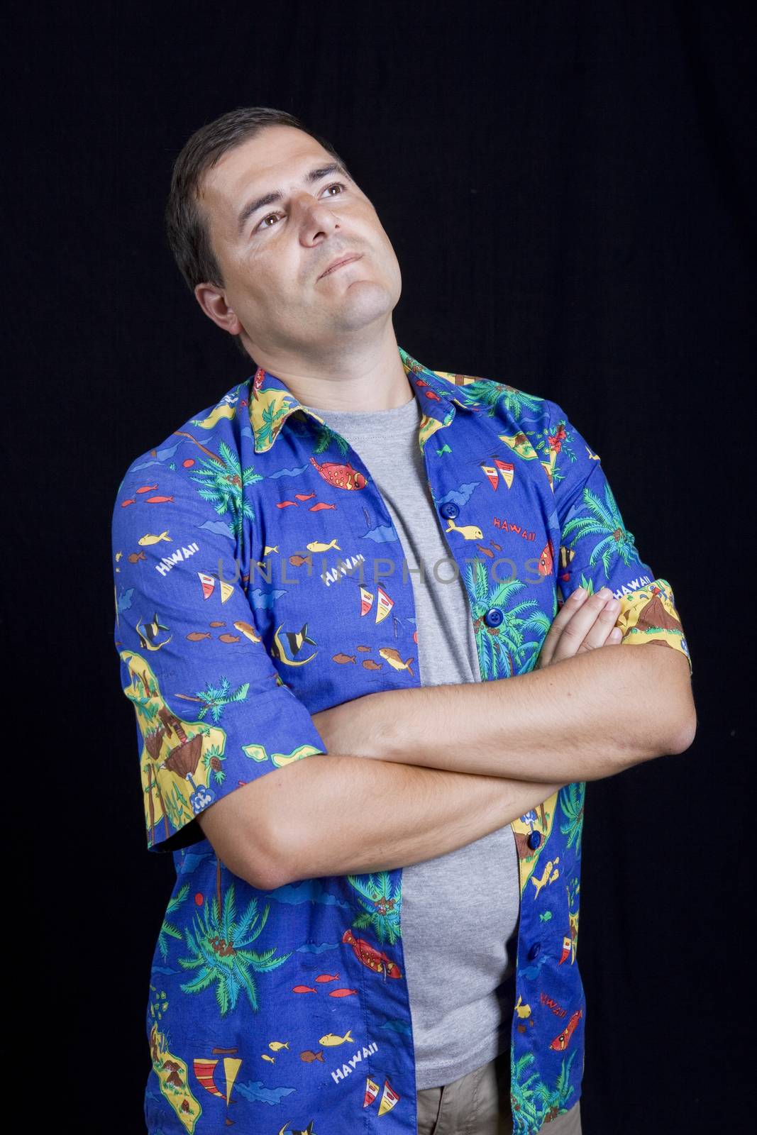 young casual man portrait on a black background