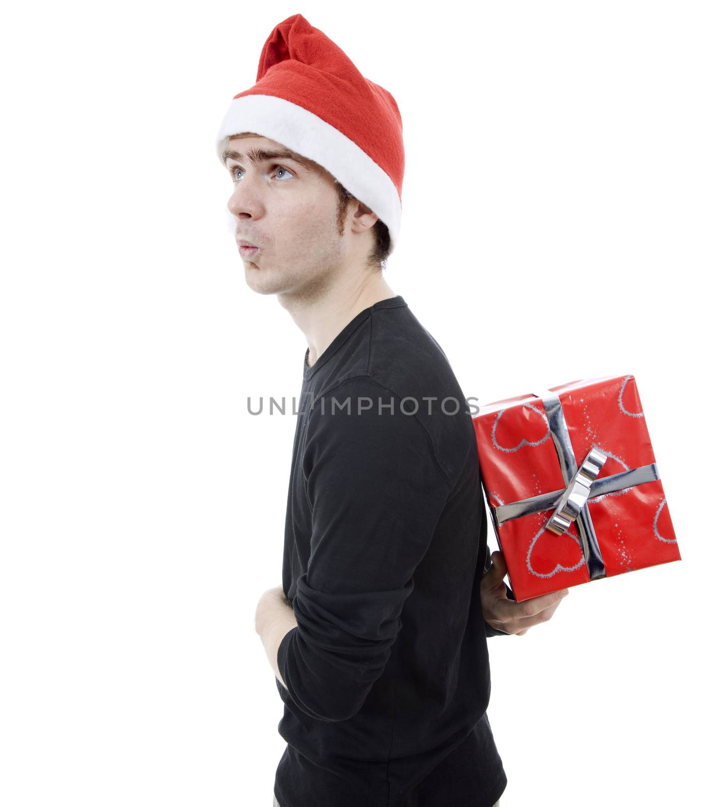 young man with santa hat holding a gift, isolated