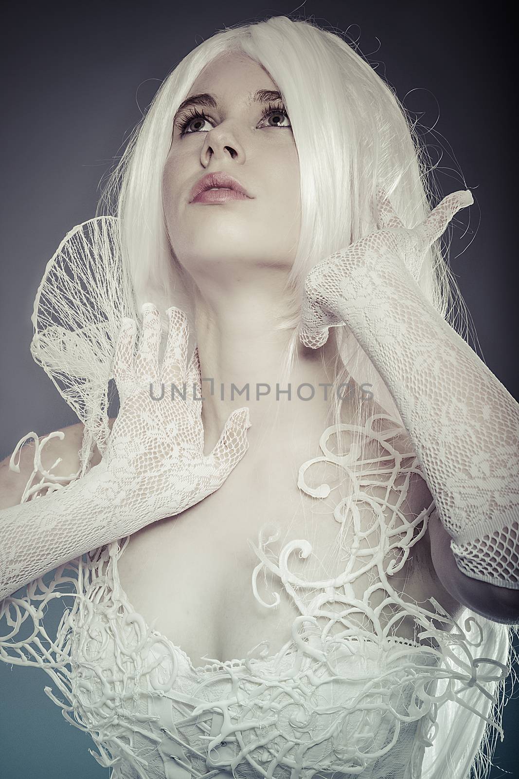 Fantasy concept, sensual young woman with vintage white violin dress