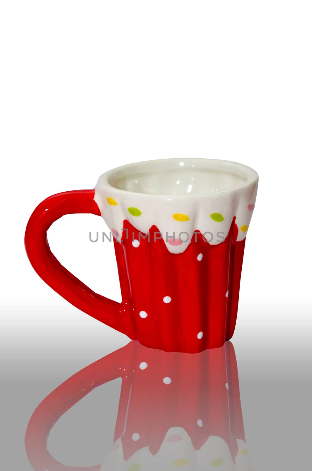 Glass of red polka dots isolated the white background.