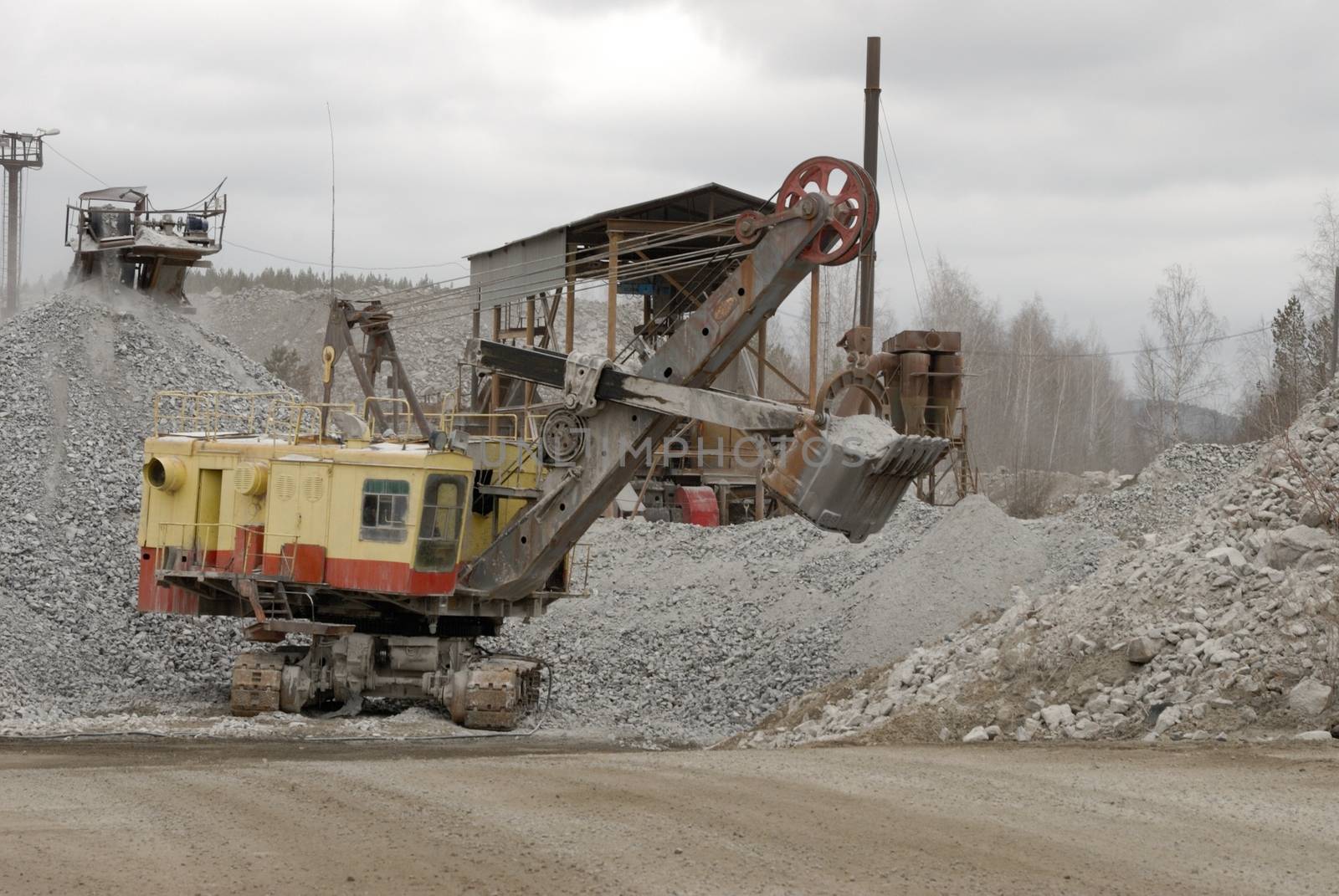 power hydraulic digger working in quarry, caterpillar