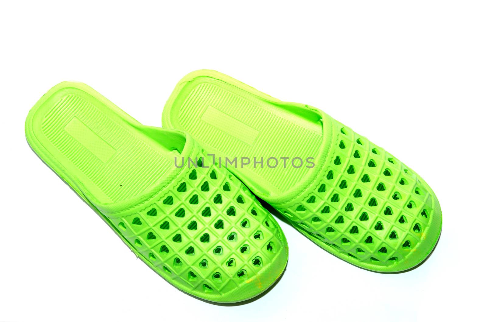 Green slippers isolated on the white background.