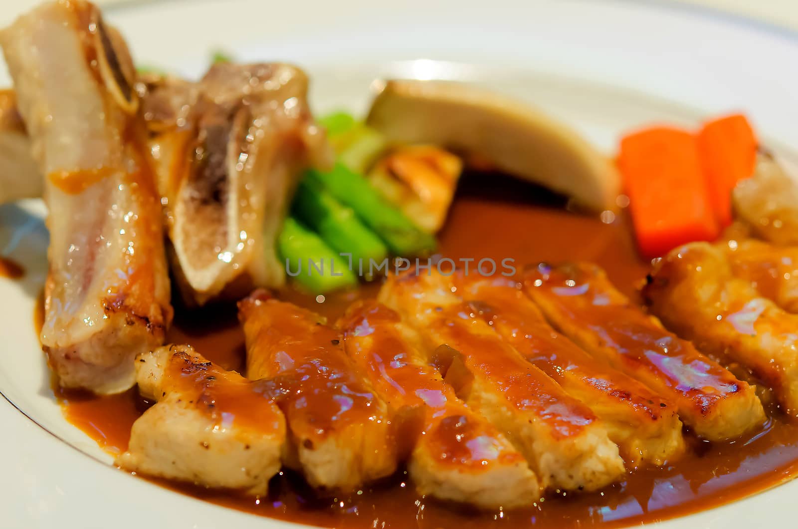 pork steak in a white plate.