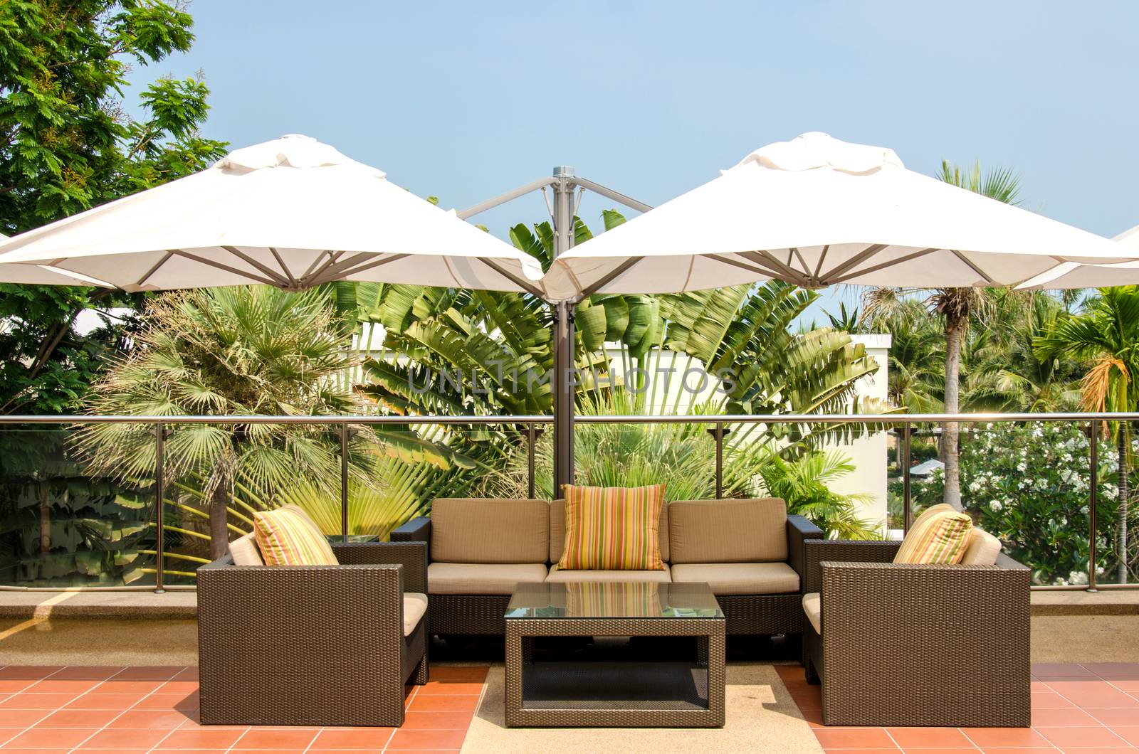 Sofas and umbrellas outside the room