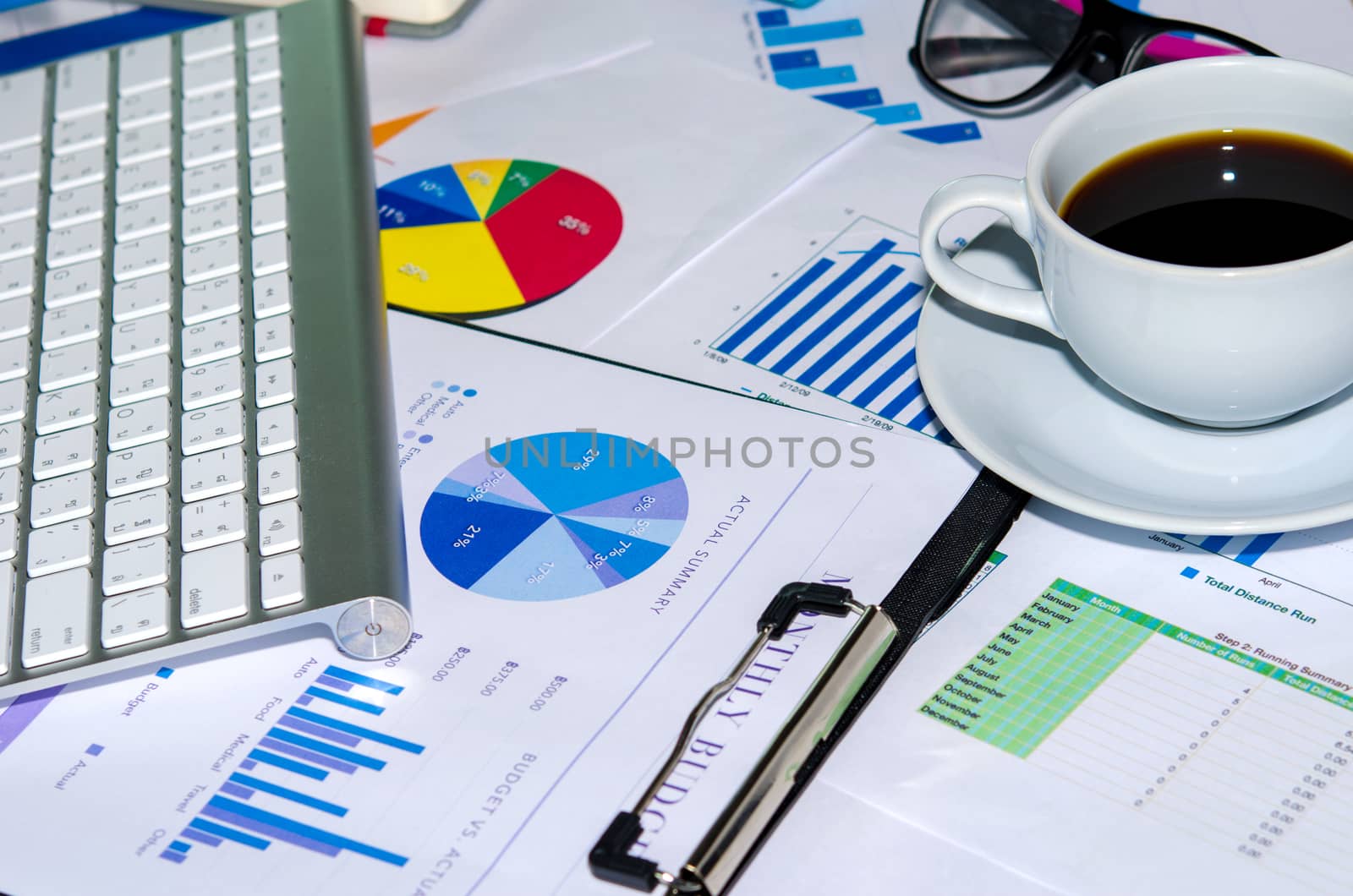 Business documents and keyboard placed on desks.