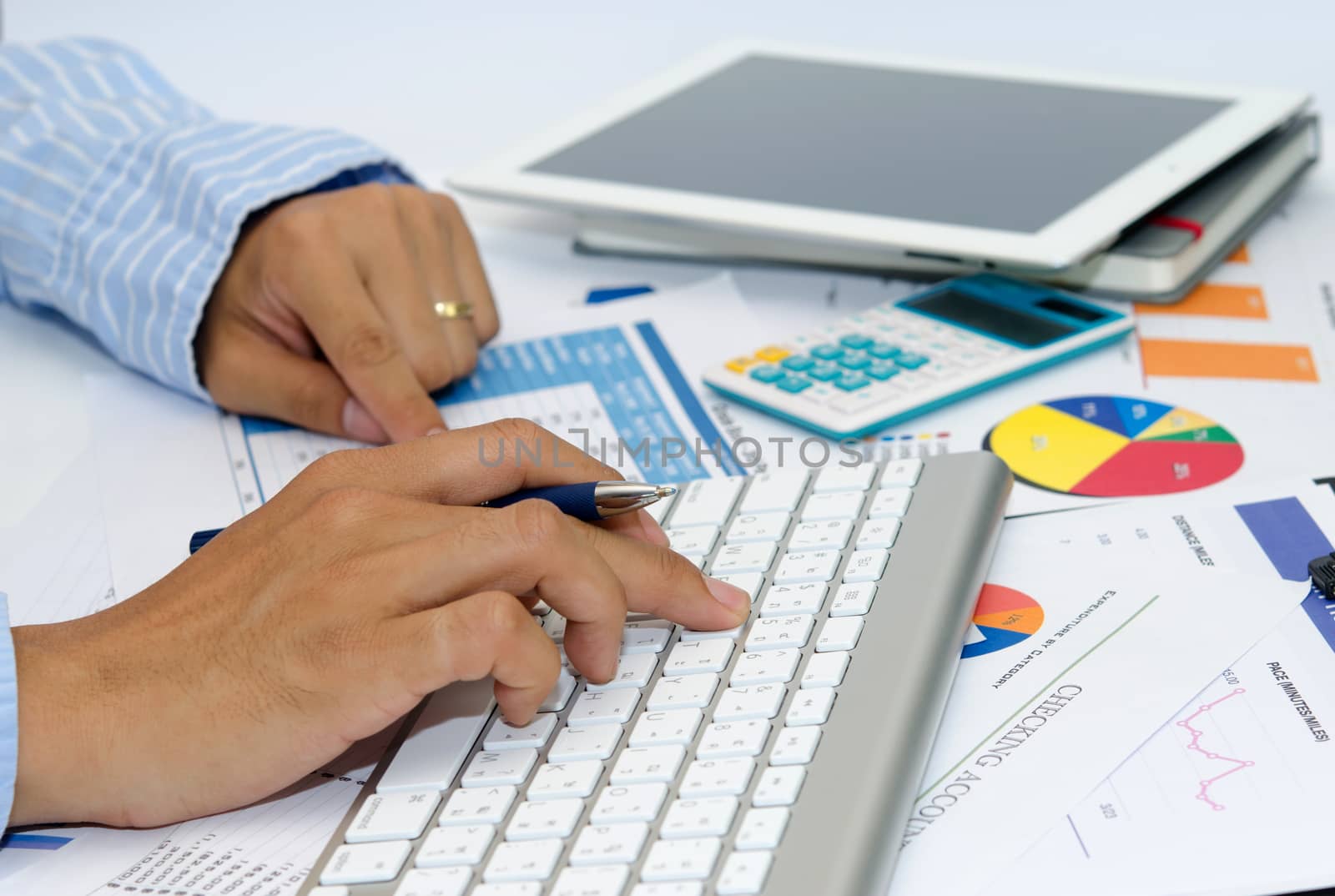 Business documents and pen placed on desks.