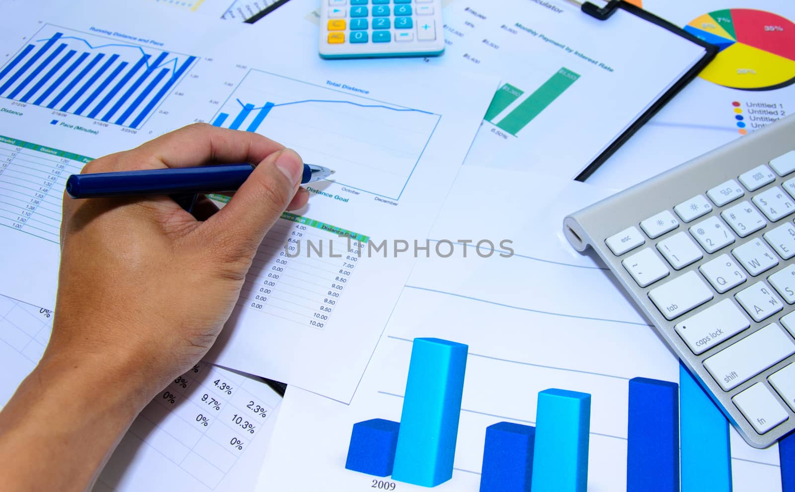 Business documents chart and pen on the table.