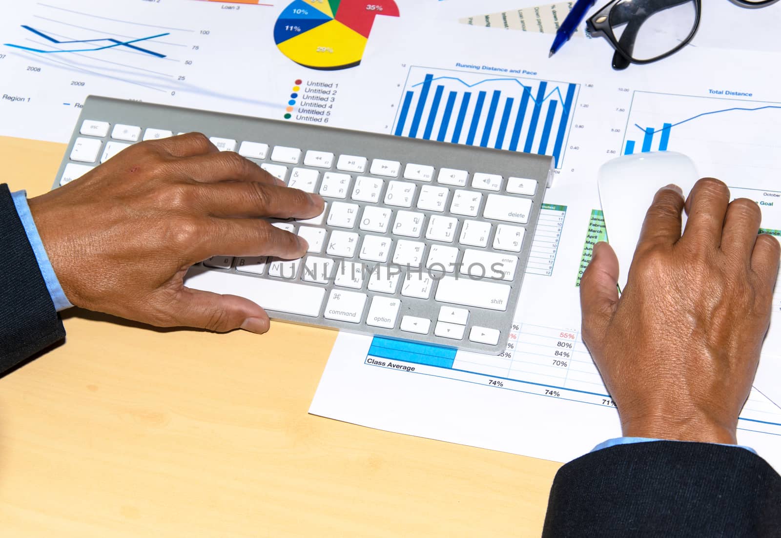 Business documents and keyboard placed on desks.