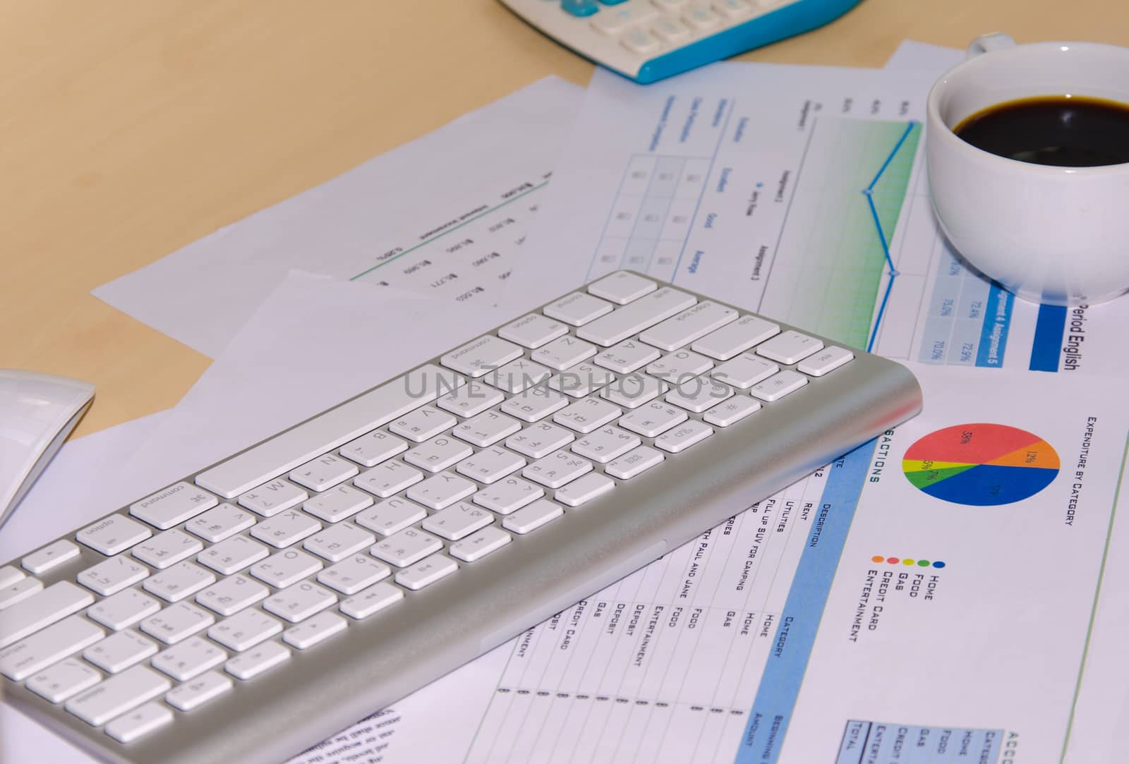 Business documents and keyboard placed on desks.