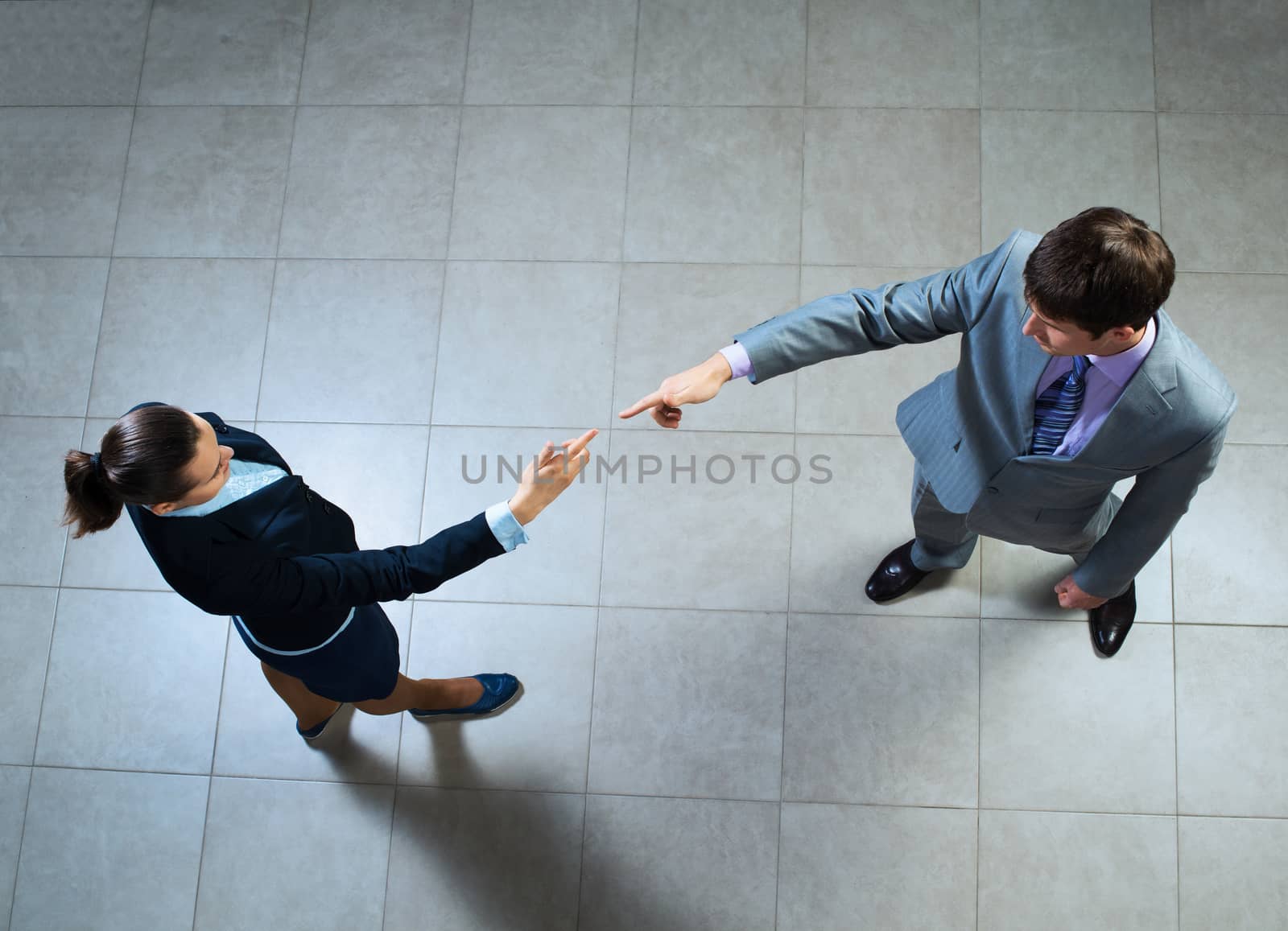 image of a two businessmen hands pointing to each other