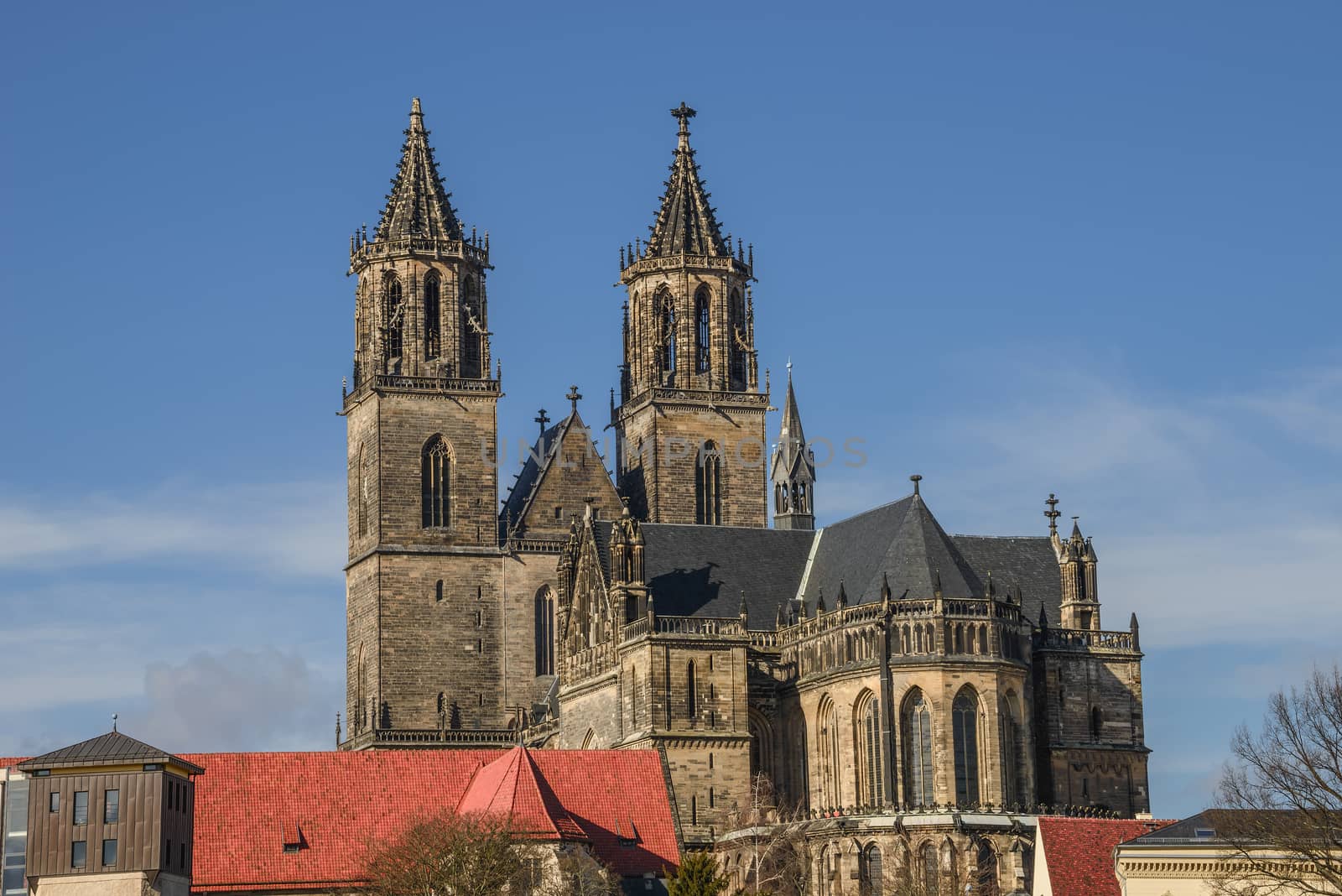 Magnificent Cathedral of Magdeburg at river Elbe with blue sky, Germany, 2014