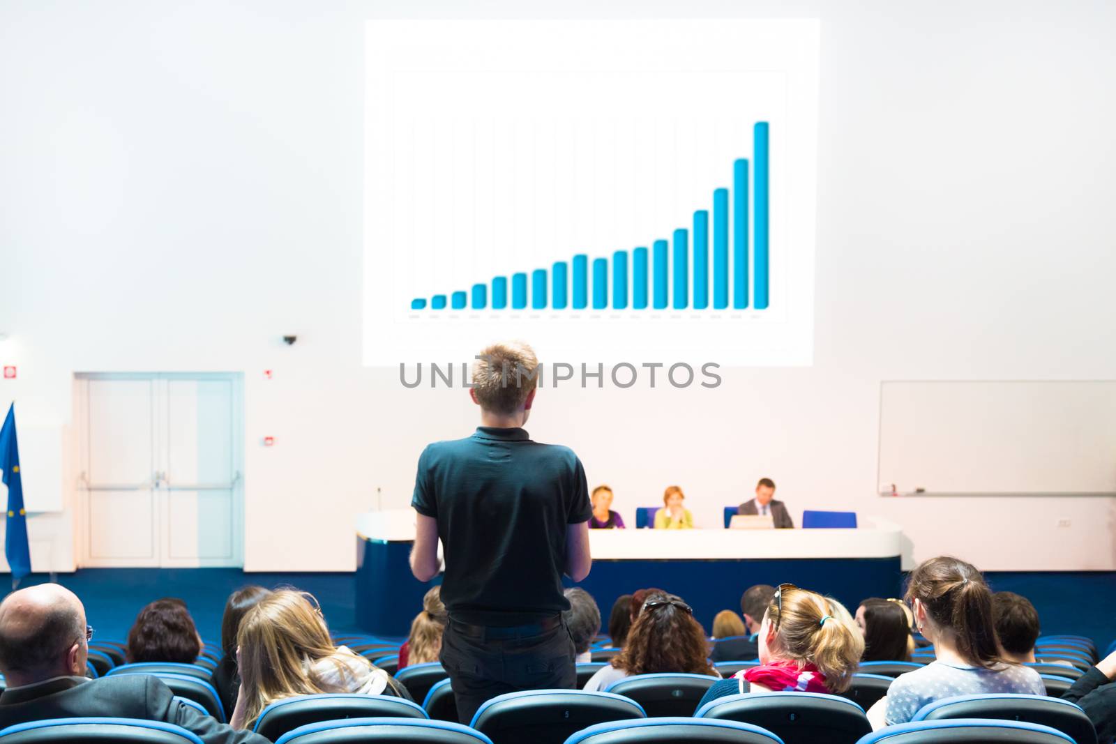 Audience at the conference hall. by kasto