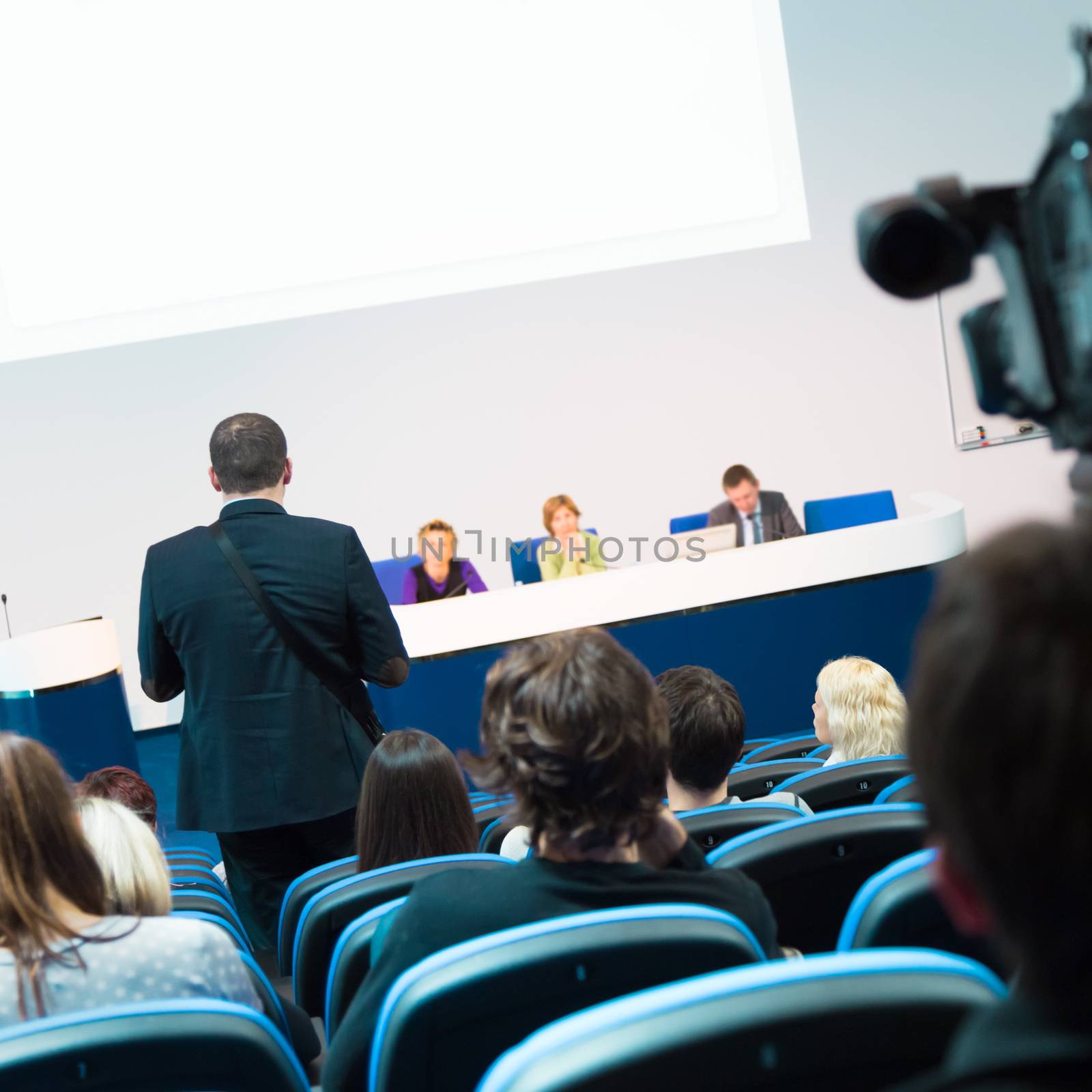 Business Conference and Presentation. Audience at the conference hall. Television broadcasted press conference.