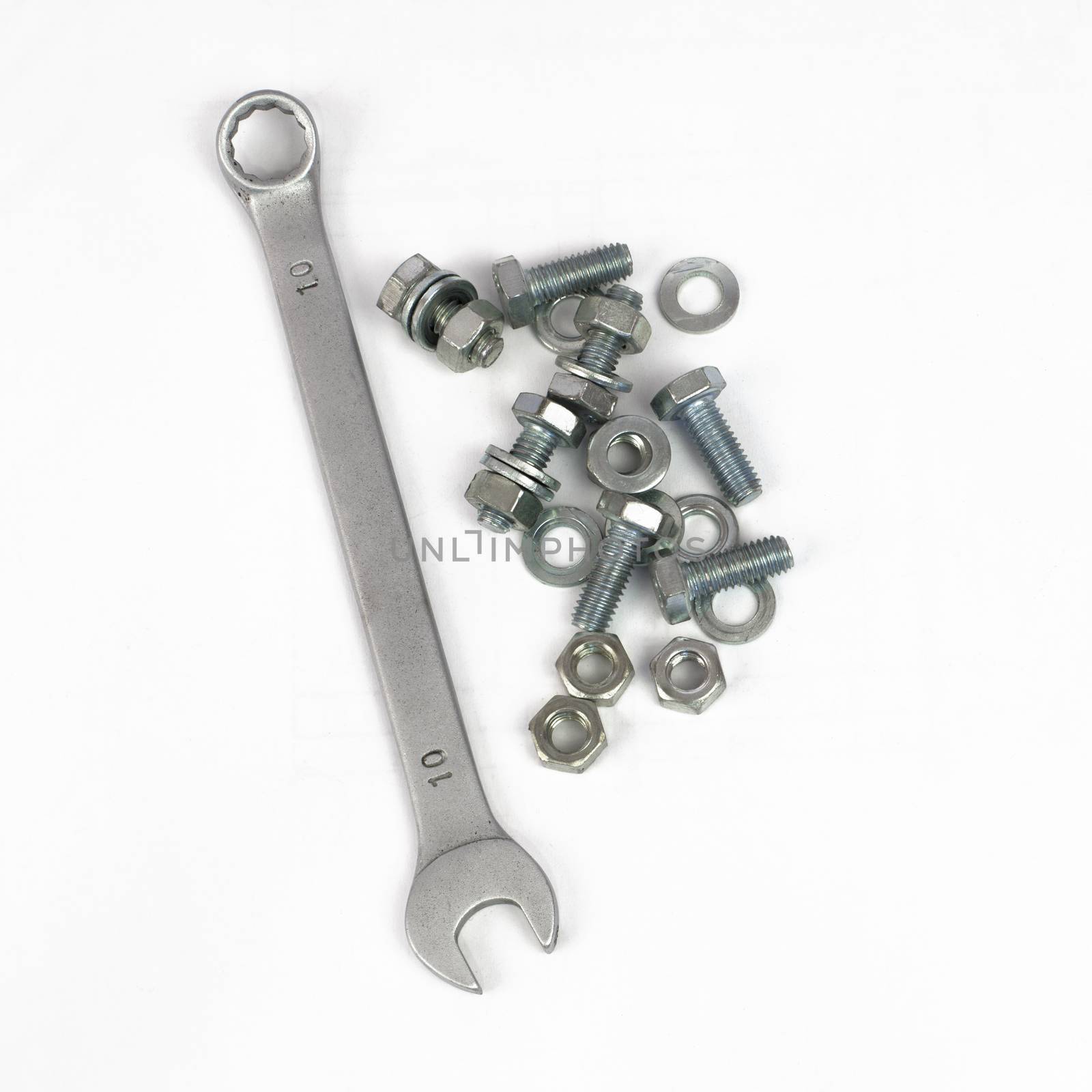 Spanner, nuts and bolts. Isolated on white background