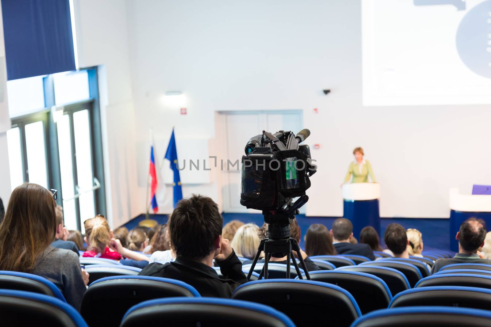 Audience at the conference hall. by kasto