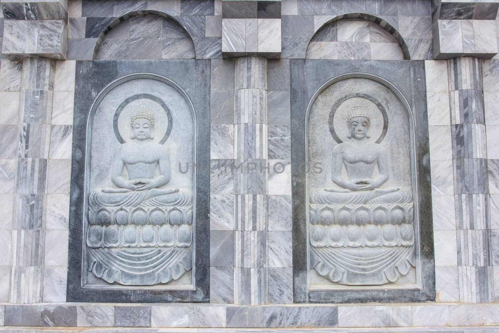 The sculpture on temple wall in Thailand which open for public