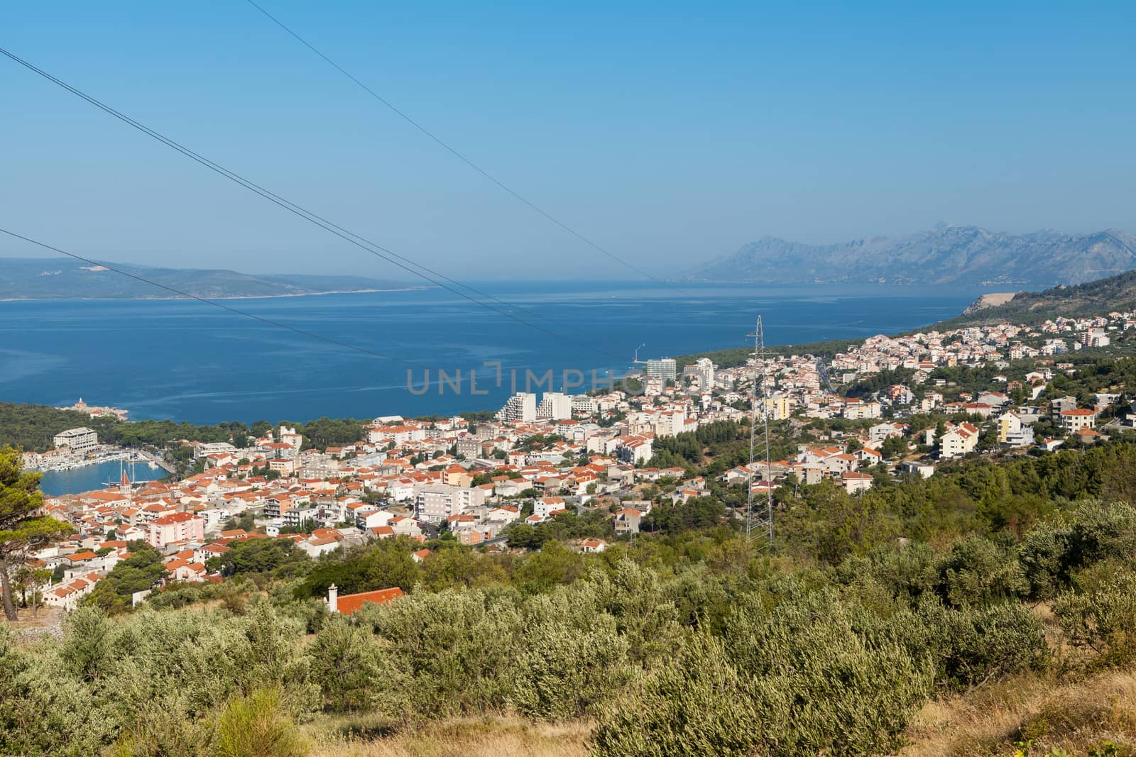 Distant view at the city of Makarska, popular touristic resort situated between Biokovo Mountains and Adriatic Sea in southern Croatia.