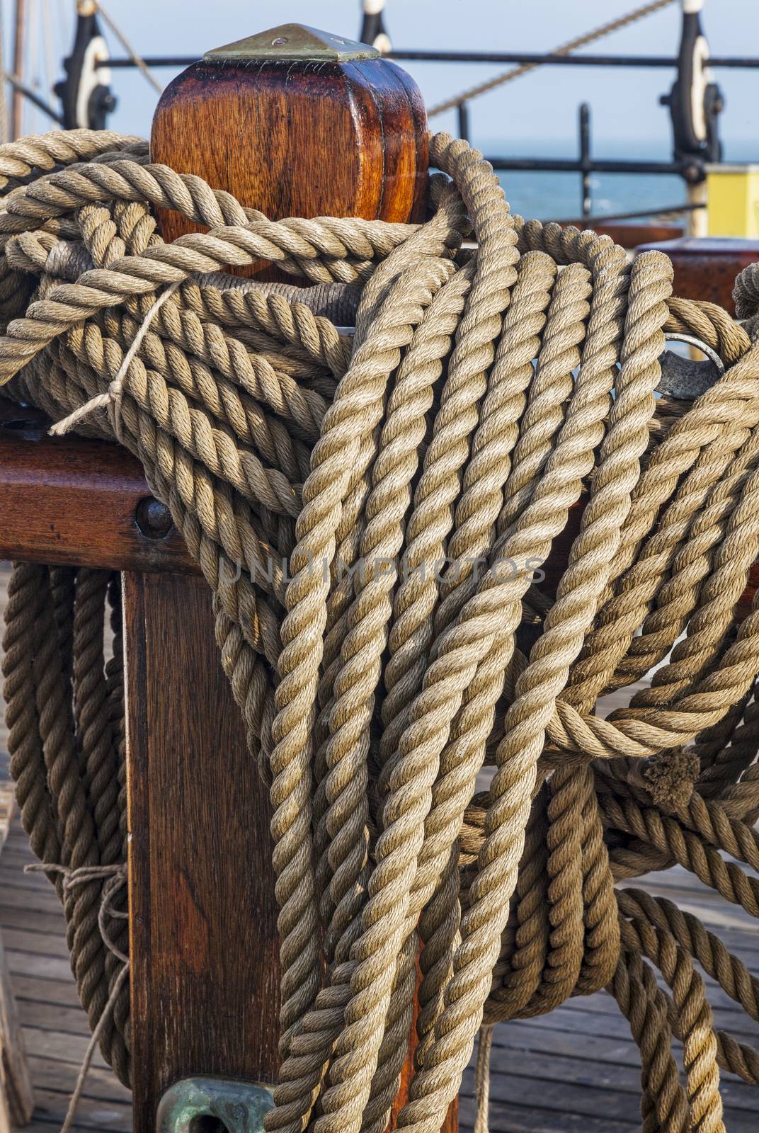 coiled ropes on a sail ship by PixelsAway