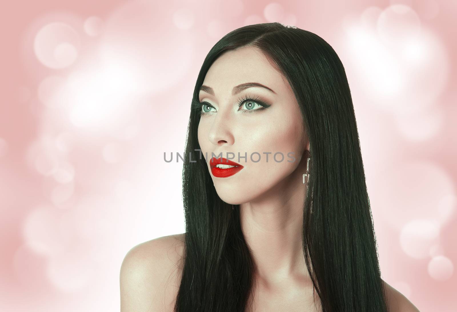 beautiful woman with bright lips on the background bokeh