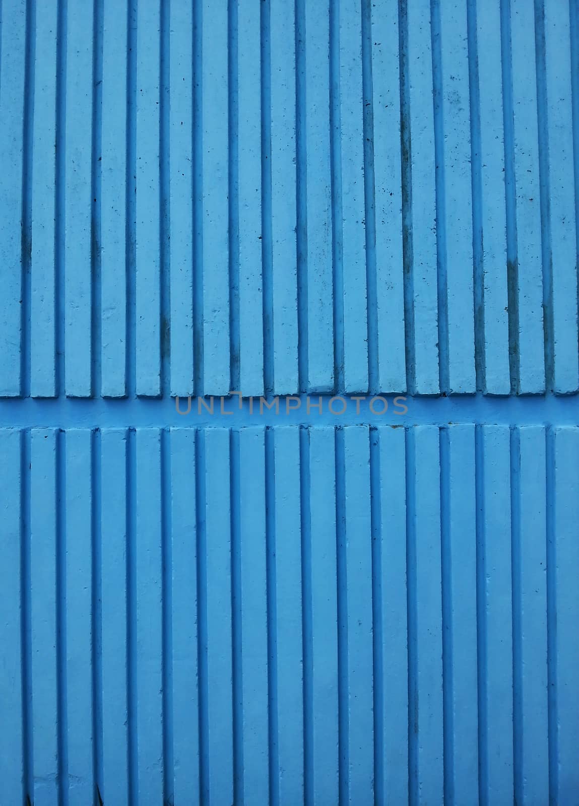 Striped blue wall texture pattern.