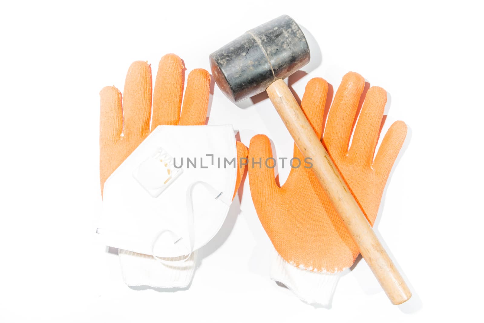 Hammer, gloves and dust mask Construction on white background