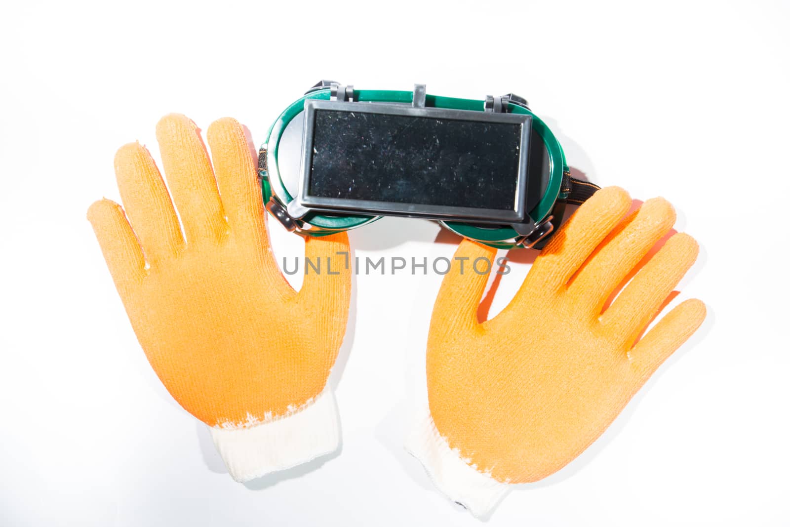 Construction gloves glasses on white background.