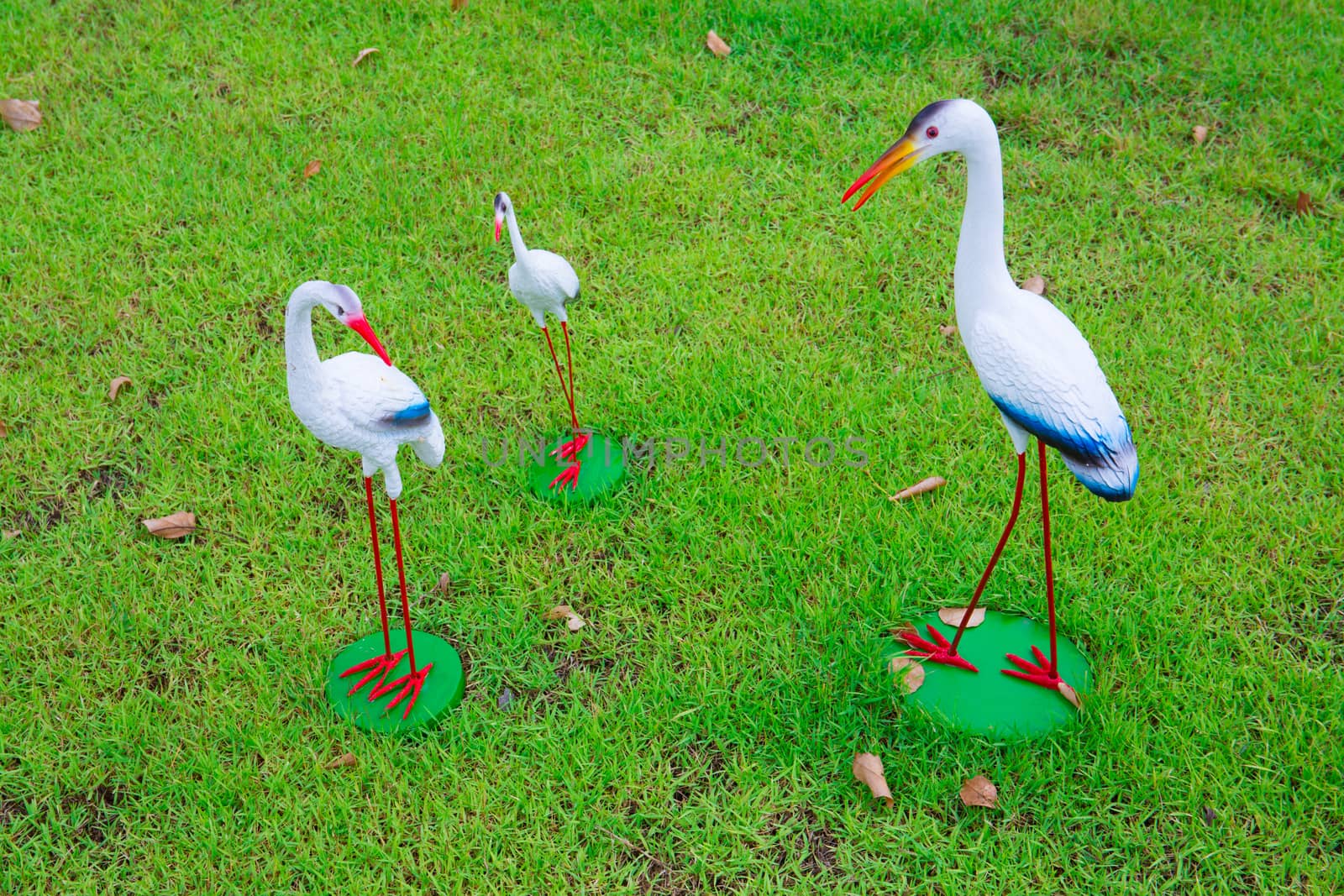 Flamingo garden ornaments in various places.