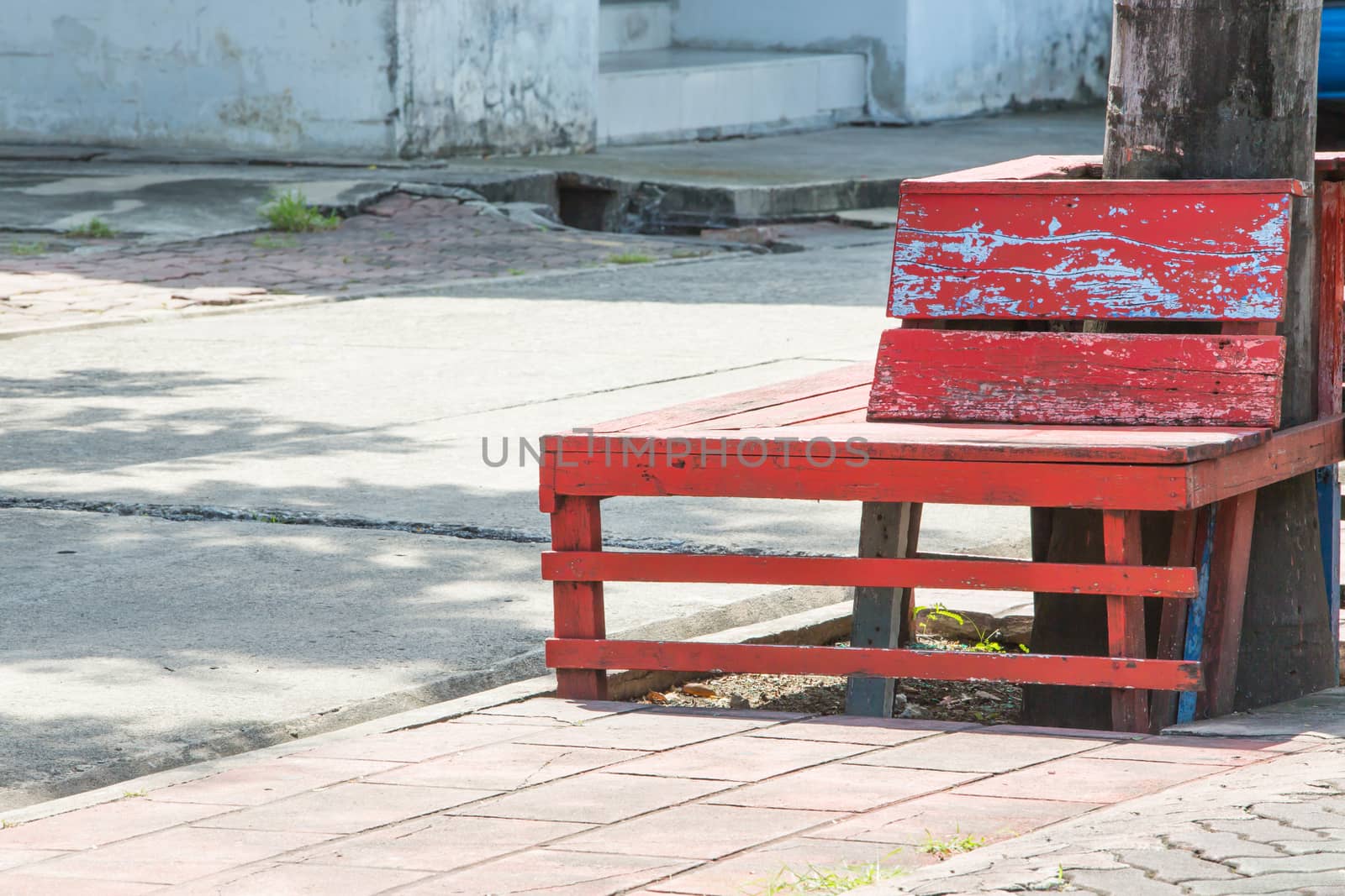 Chair on the side of the footpath.