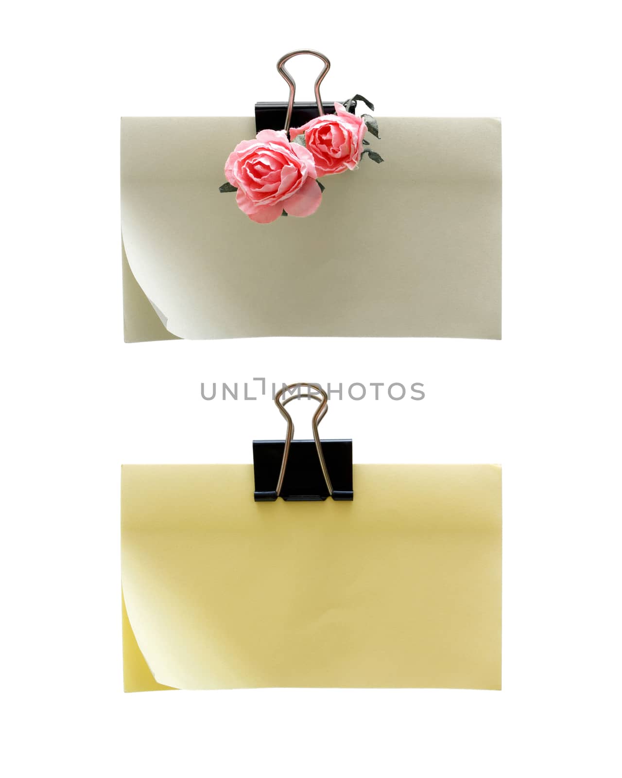 Paper-clip holding blank post-it isolated on white background