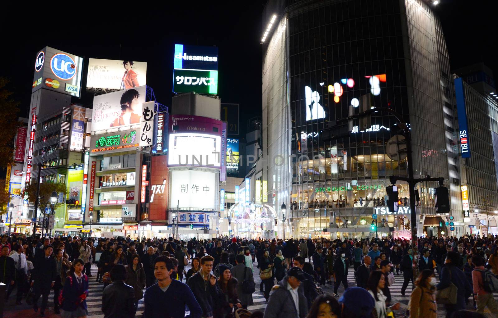 TOKYO - NOVEMBER 28: Pedestrians at the famed crossing of Shibuya by siraanamwong