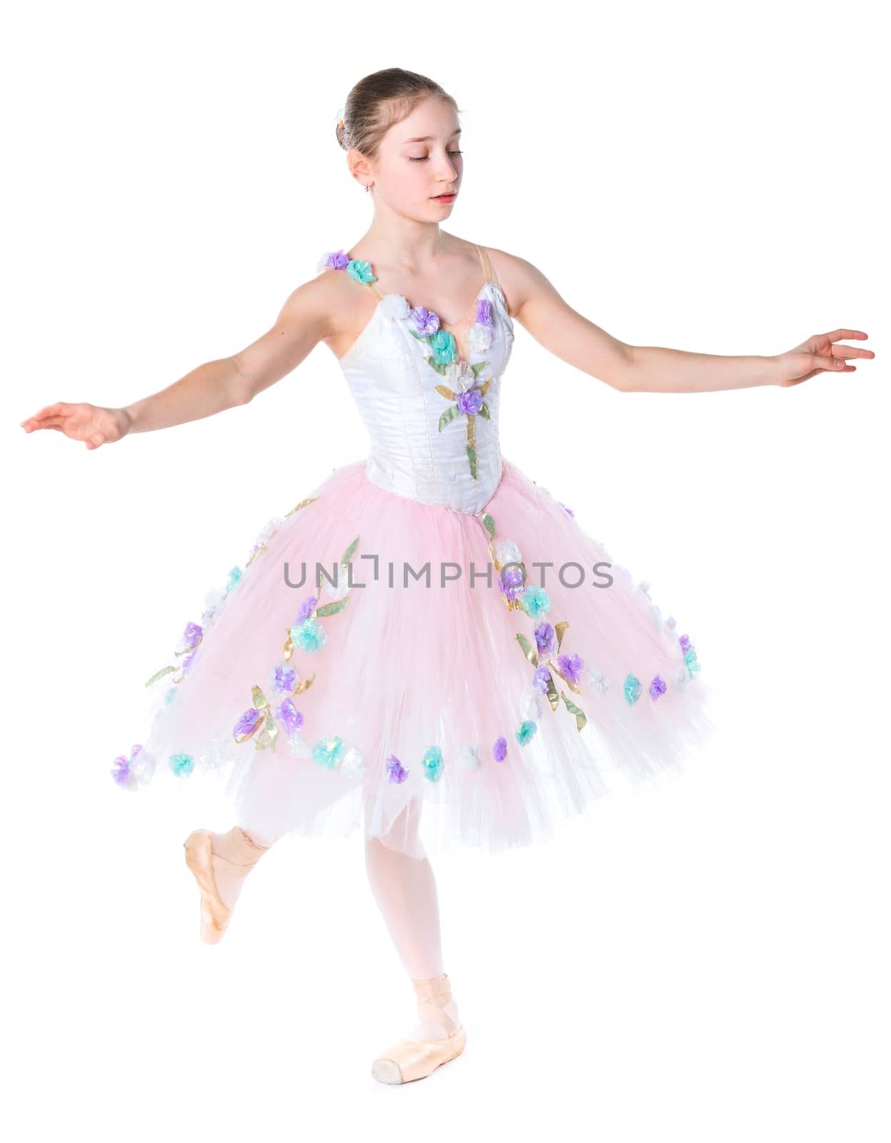 Beautiful young ballerina on a white background