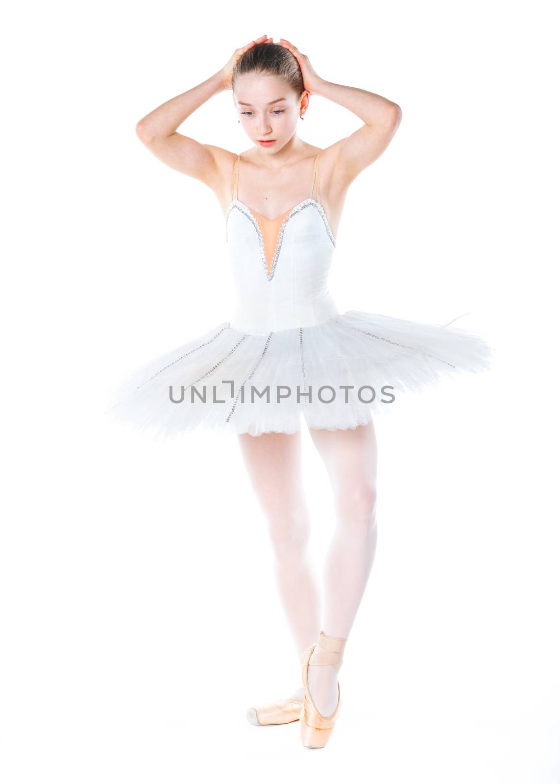 Beautiful young ballerina on a white background